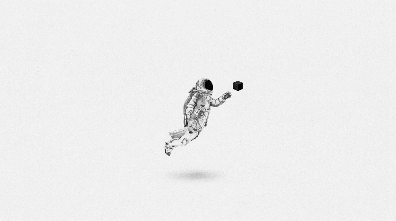 An astronaut floating towards a small black cube