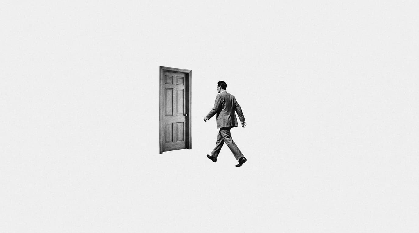 A man in a suit walking through the air towards a floating door